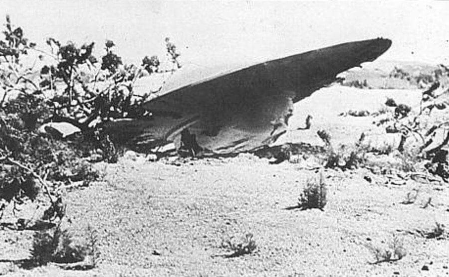 A crashed UFO in the desert.