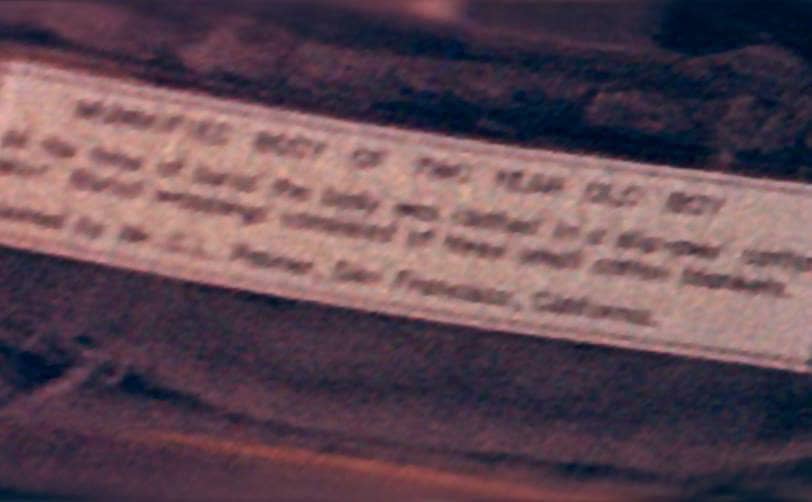 A photograph of the blurred place card.