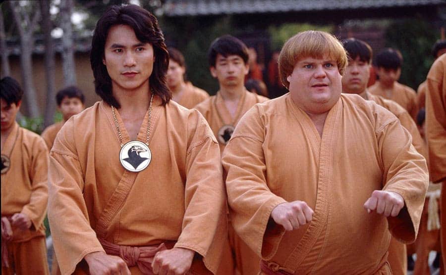 Robin Shou and Chris Farley practicing martial arts in a film still from Beverly Hills Ninja