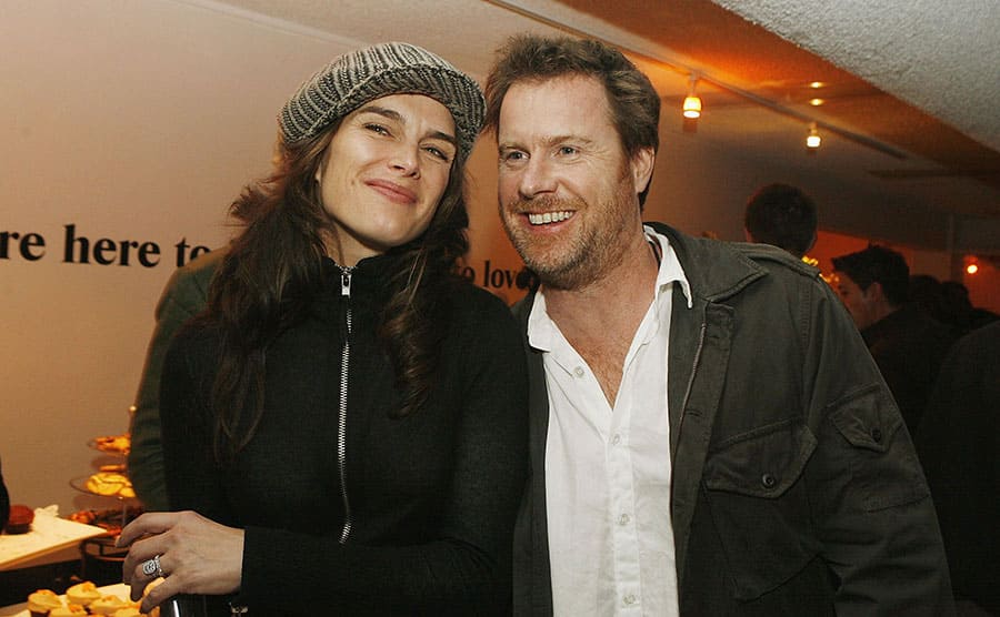 Brooke Shields and Chris Henchy posing together at a party