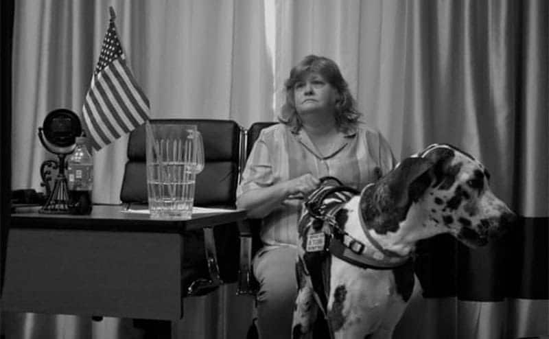 Shana and her support dog, Bolt, at a conference.