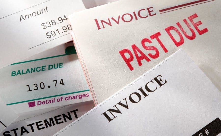 random selection of bills or invoices with one of them stamped 