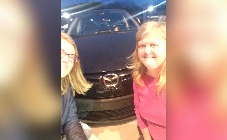 Shana and her daughter are taking a selfie. 