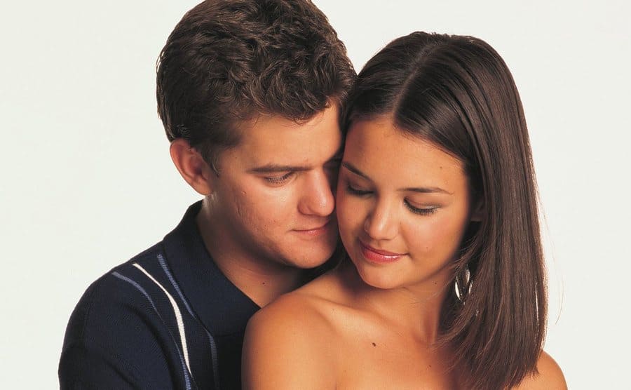 Pacey hugging Joey from behind in a promotional photograph