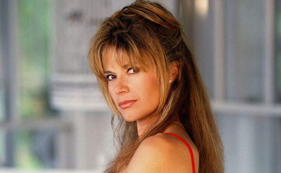 Mary Margaret Humes in a red dress in a promotional photograph for Dawson’s Creek
