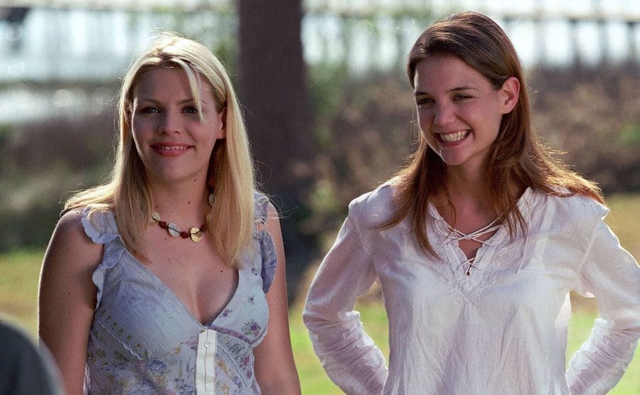 Busy Philipps and Katie Holmes standing outdoors in a scene from Dawson’s Creek