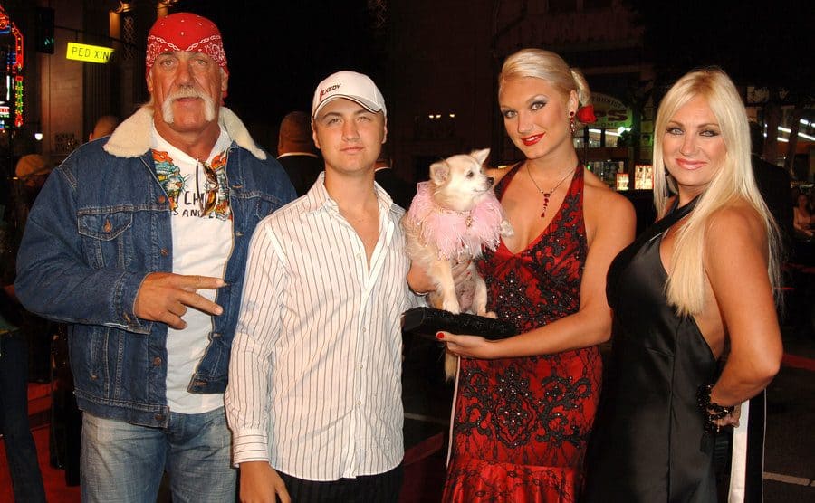 Hulk, Nick, Brooke, and Linda Hogan posing on the red carpet 