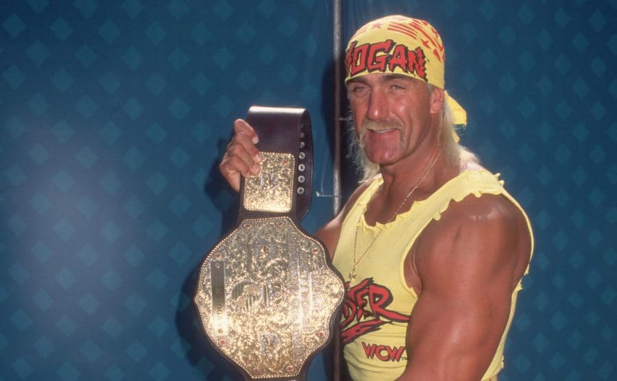 Hulk Hogan holding his Championship belt 