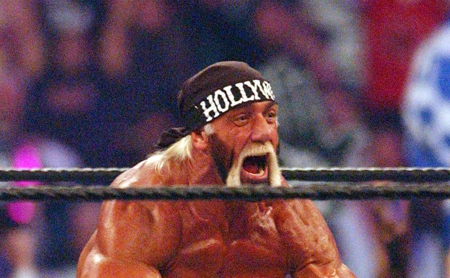 Hulk Hogan flexing and screaming in the ring 