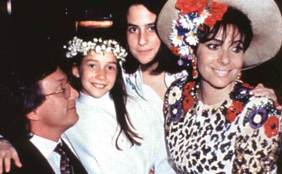 Maurizio Gucci, Allegra Gucci, Alessandra Gucci and Patrizia Reggiani posing for a family photo during an event.