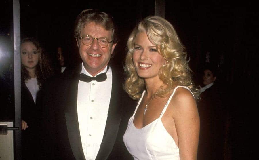 Jerry Springer and model Vendela arriving at an event