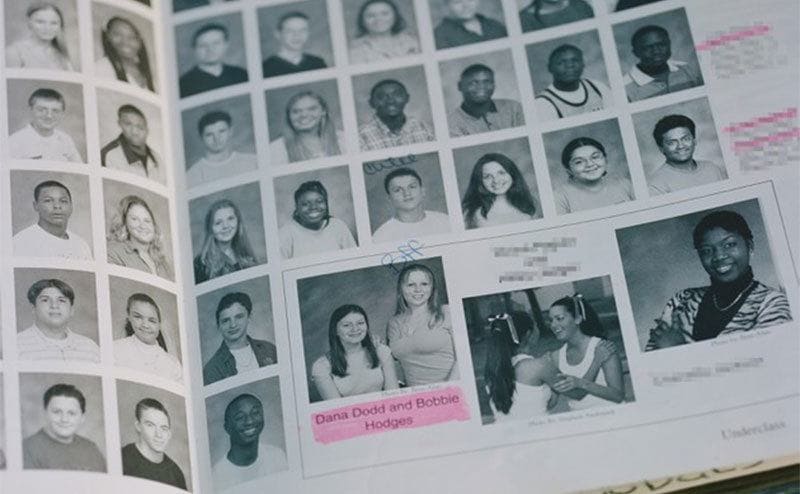 A page out of Dana’s old high school yearbook with a photo of her.