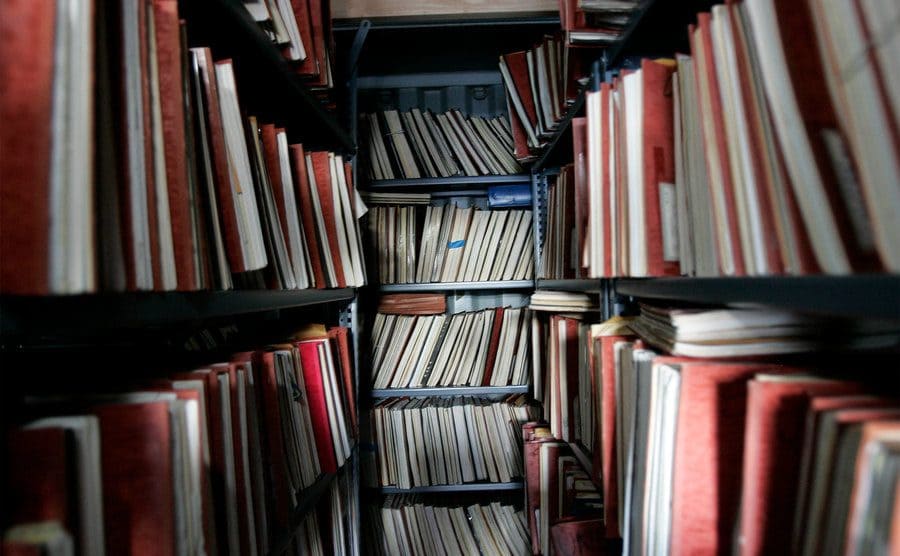 Fully stacked shelves of old unsolved murder cases.