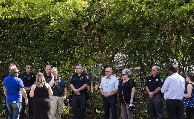 Dana’s friends, family, and even police officers paying their respects at her grave.