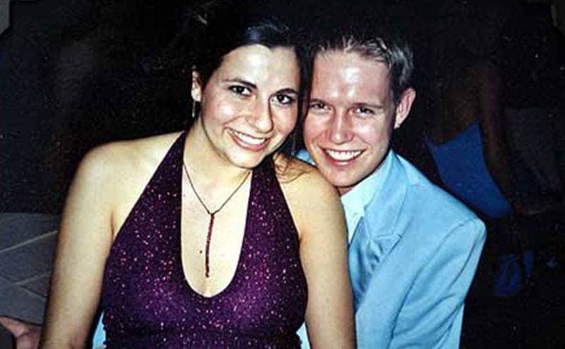 Ali Kemp is sitting on her boyfriend’s lap during a school dance.
