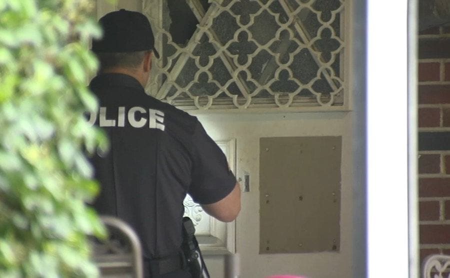 Police knocking on the front door.