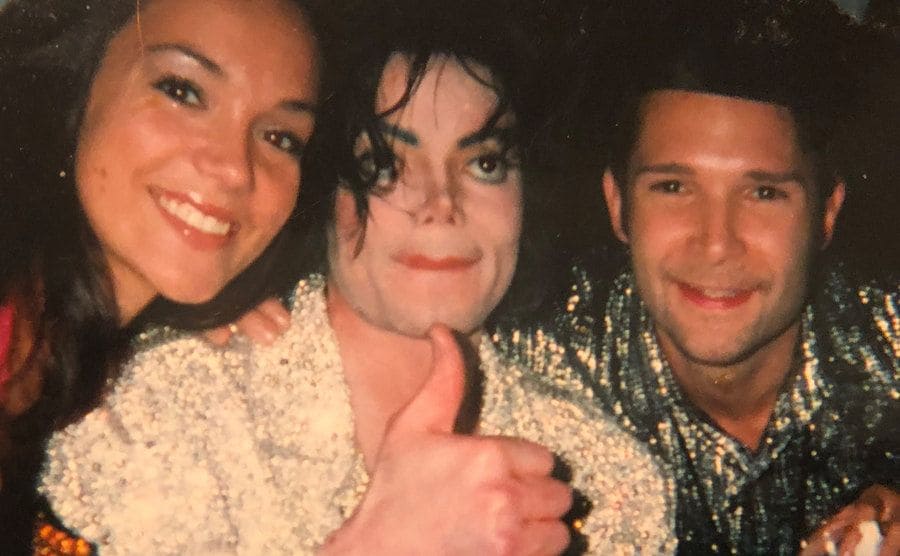 Feldman and Jackson pose with another woman at a restaurant.