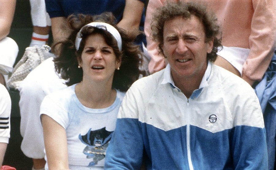 Actor Gene Wilder and his wife, Gilda Radner watching a tennis match.