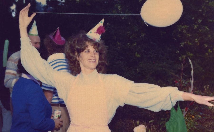 Gilda playing with a balloon during a birthday party.