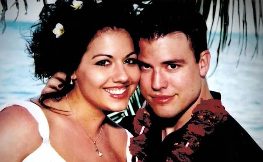 Vashti and Brett at their wedding on the beach.