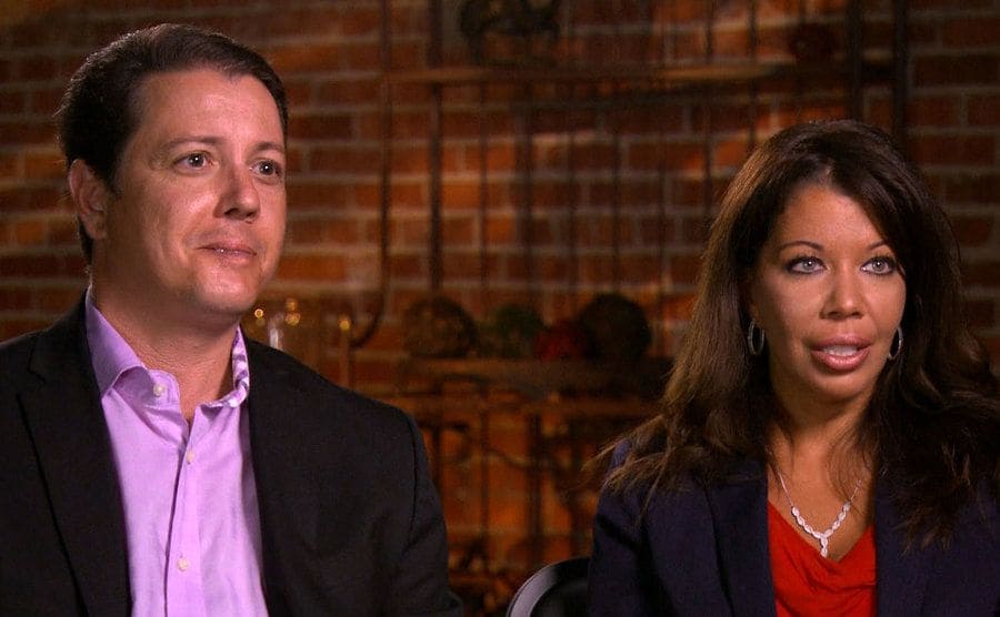 Kathleen and Rich sitting being interviewed on TV regarding the murder of their dear sister.