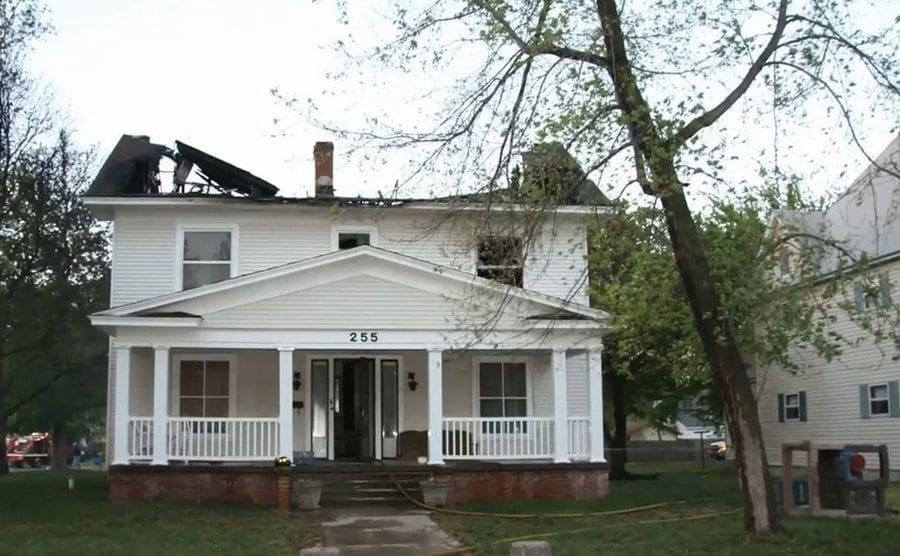 View of the house after the fire destroyed the entire roof.