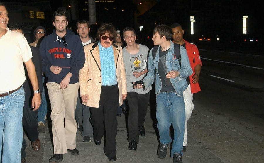 Comedian Bob Zmuda is dressed as the lounge singer Tony Clifton, as he leads Andy Kaufman fans on a candlelight vigil down Sunset Blvd.