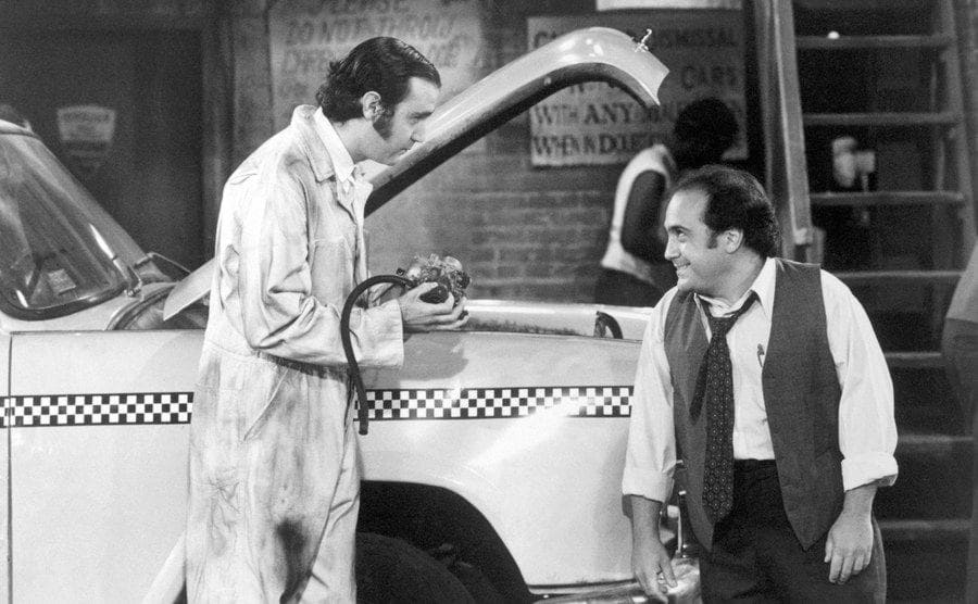 Andy Kaufman, as Latka Gravis, and Danny DeVito, as Louie DePalma, in a scene from Paramount Television's series, Taxi.