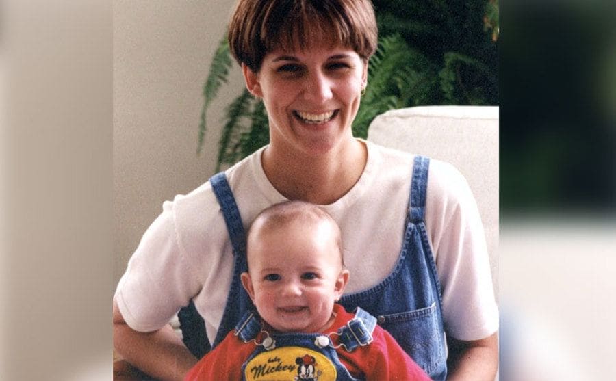 Farver is smiling as she holds her newborn baby boy, Max.