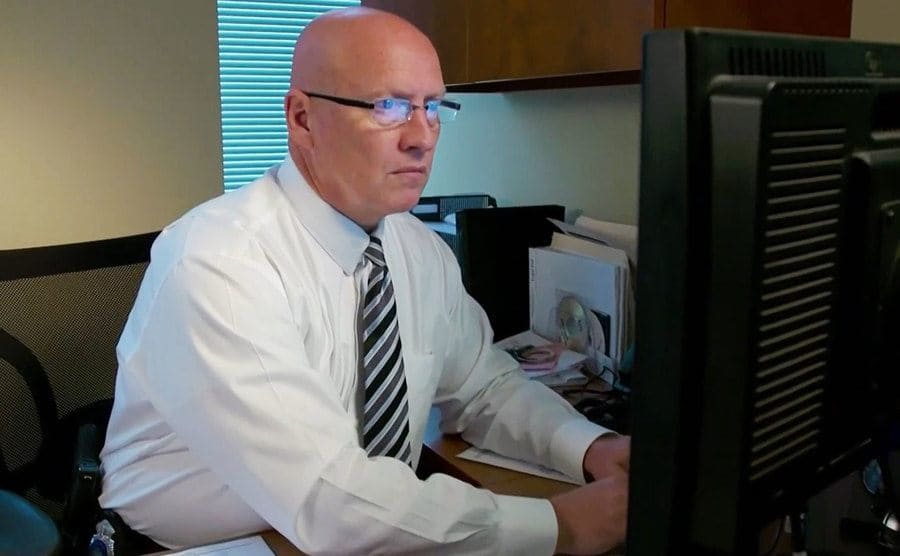 A detective is sitting in his office working on the Cari Farver case.
