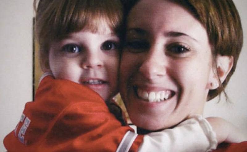 Caylee hugs her mom, Casey, as she is being held. 