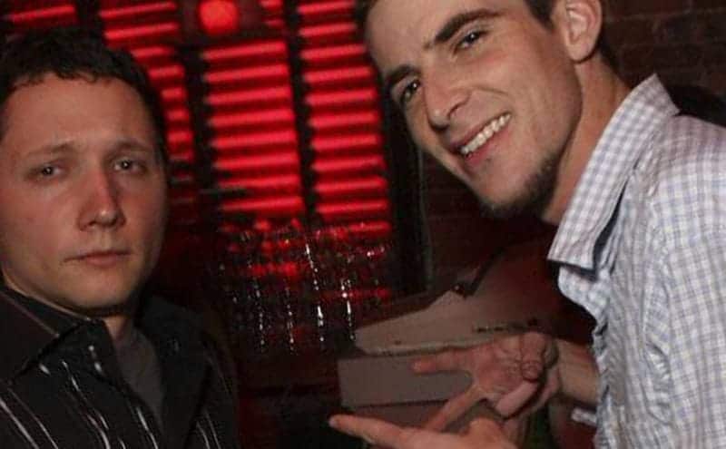 Tony Lazaro and Clint House are standing next to a bar in a nightclub. 
