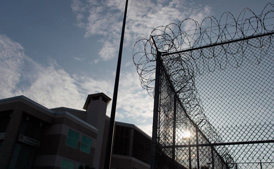View to the Orange County Jail and its barbed wire fence. 