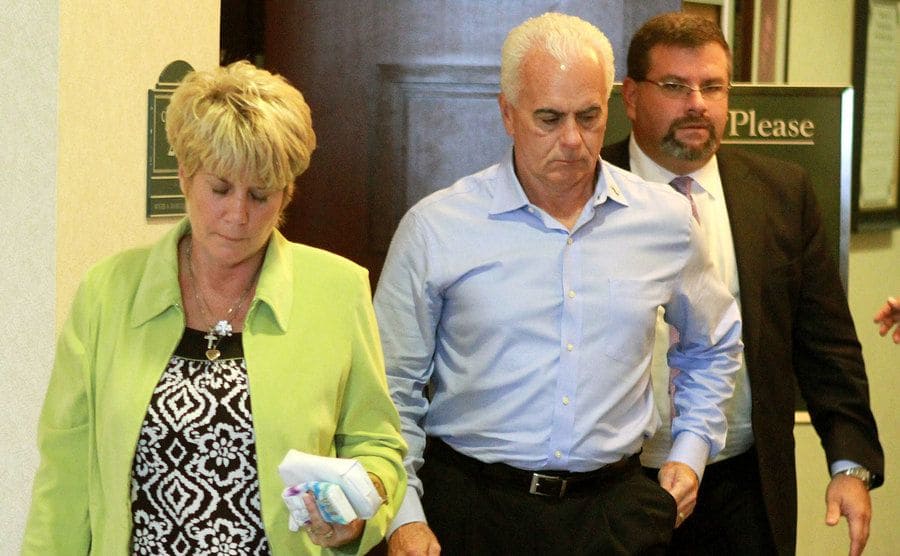 Cindy and George Anthon are the first to leave the courtroom with their attorney.