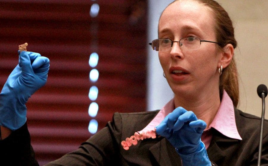 A crime scene investigator shows letters from Caylee's T-shirt.