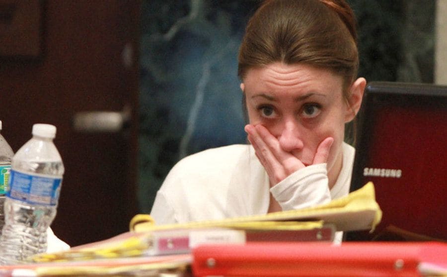 A close-up on Casey's nervous expression before hearing the verdict. 