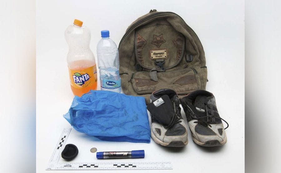 The items found in the wheel well such as the back, the bottles, and sneakers.