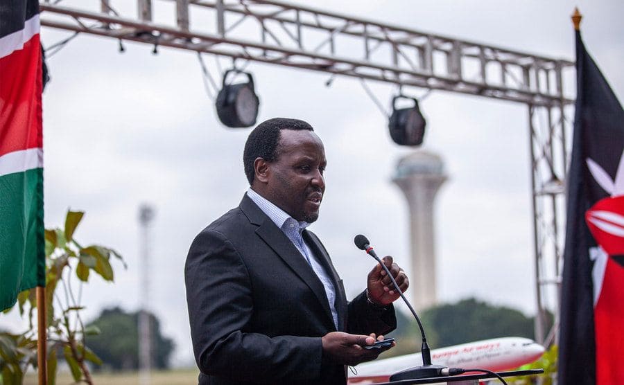 Chief executive officer at Kenya Airways Ltd., speaks before a crowd.
