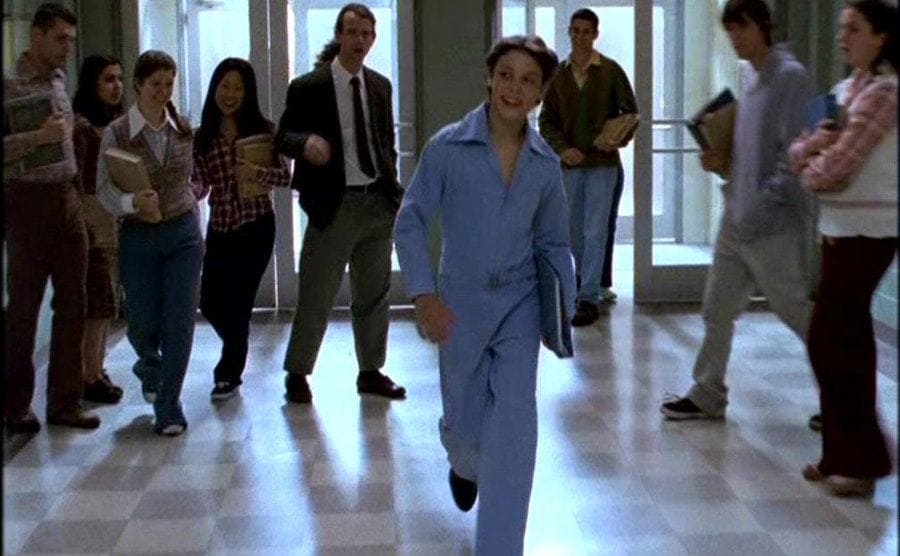 Sam walks into school strutting his stuff in his new jumpsuit.