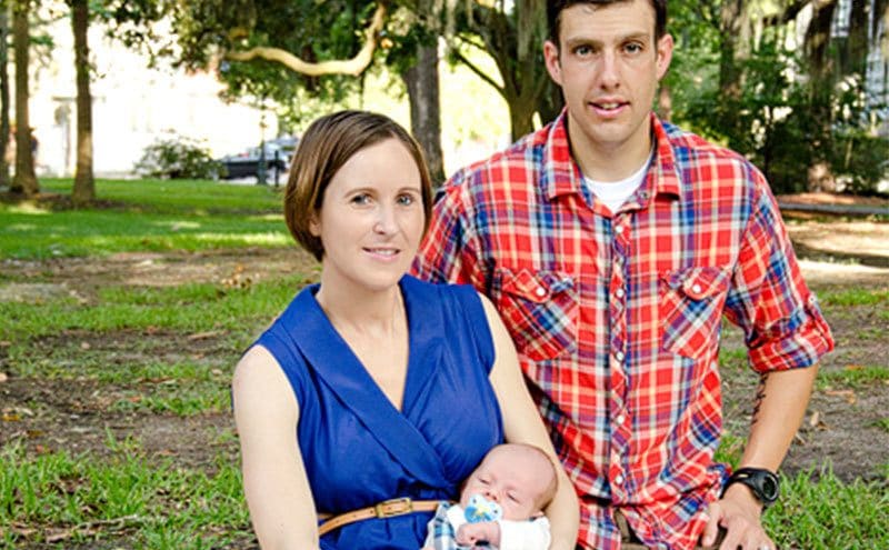 Kane poses next to his first wife and baby daughter.