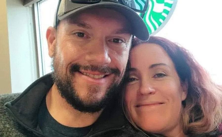 Jason and Kristi take a photo in Starbucks.