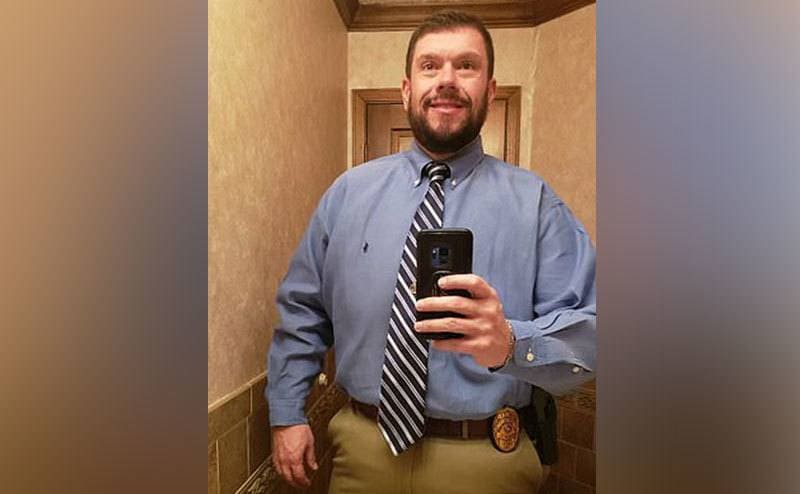 Jason Collier takes a selfie in the bathroom mirror.