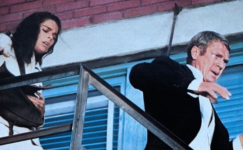 Ali MacGraw and Steve McQueen run through the stairways in The Getaway.