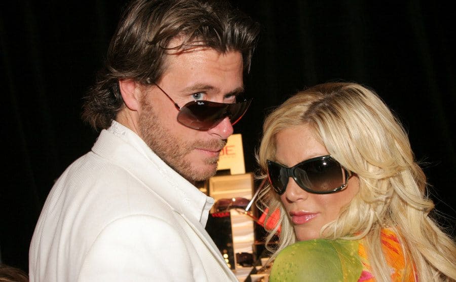 Tori Spelling and Dean McDermott are gazing back at the camera.