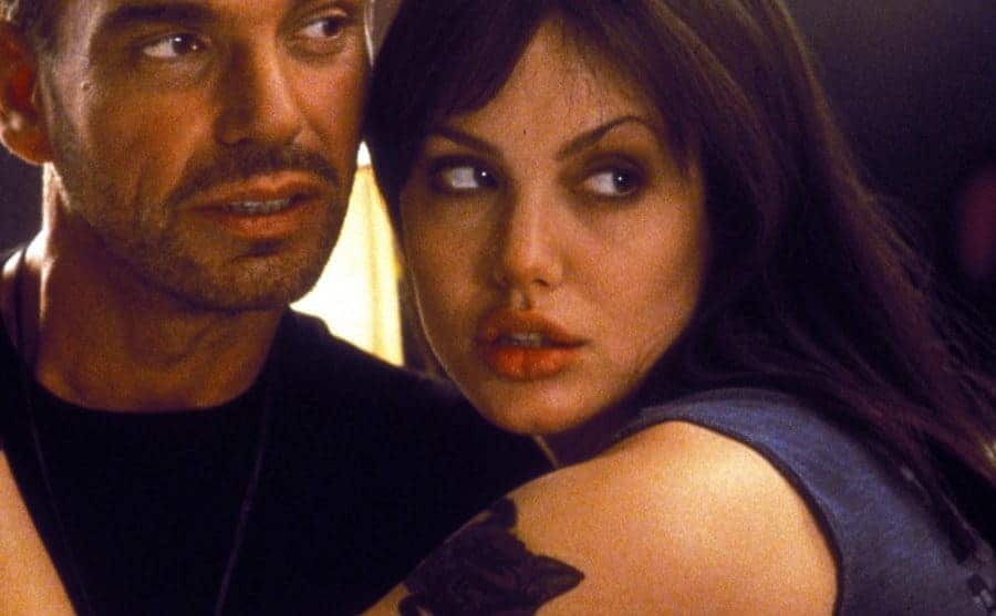 Angelina Jolie wraps her arm around Billy Bob in a publicity still from the film.