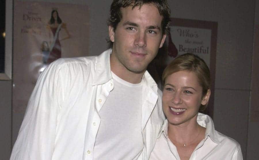 Ryan Reynolds and Taylor Howard are posing together.