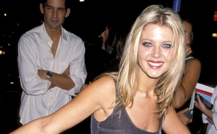 Tara Reid is attending a nighttime event.