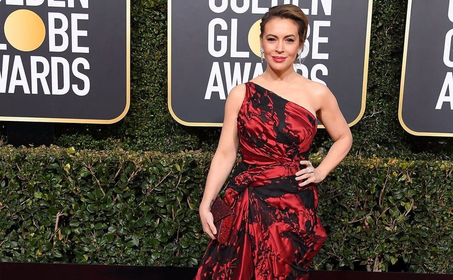 Alyssa Milano walks the red carpet of the Golden Globe Awards.