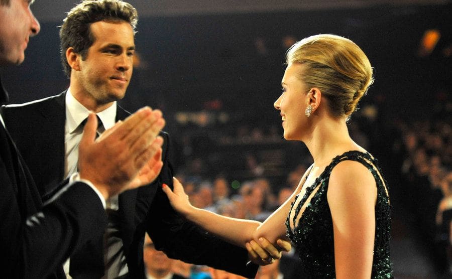 Ryan Reynolds congrats Scarlett at the Tony Awards as she stands up to get her award.