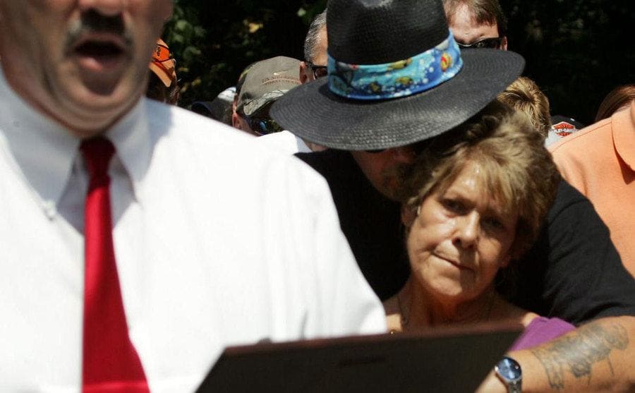 Linda is comforted by David Joiner as the memory of her niece is being honored by local authorities.